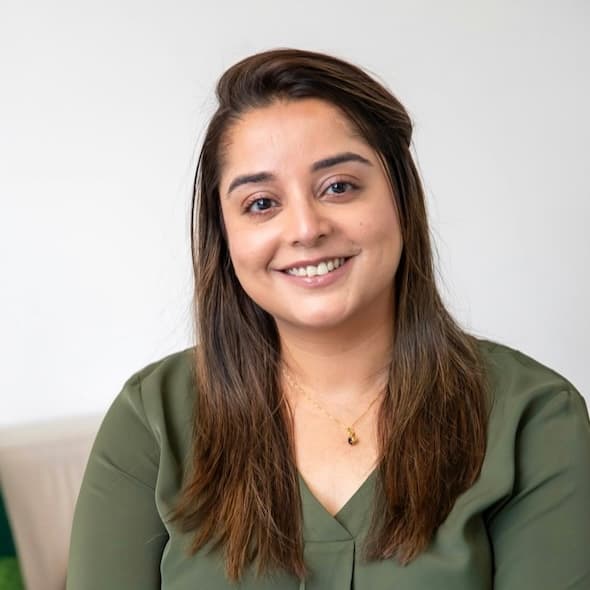 Tanya Singh, PhD, smiling in a professional setting